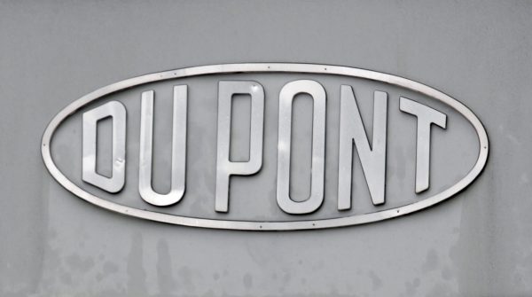 The DuPont logo is seen on a sign at the entrance to the company's Spruance Plant in Richmond, Va., on April 22, 2008. DuPont said Tuesday, Dec. 29, 2015, it will cut 1,700 jobs in its home state of Delaware and thousands more globally as it prepares for its merger with Dow Chemical. (AP Photo/Steve Helber)