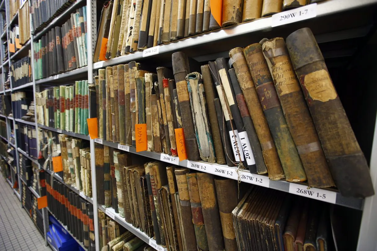 Files and books are stored in the temperature-controlled storage room where historic archived documents are stored on shelves of the Paris Police Prefecture Archives department, in Paris, France, on Dec. 29, 2015. France is opening police and legal archives from the collaborationist Vichy regime, allowing free access to previously classified documents from World War II. (AP Photo/Francois Mori)