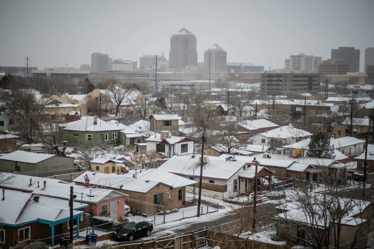 Snow covers roof tops in Albuquerque, N.M., on Dec. 26, 2015. A flurry of snow began to blanket Albuquerque, Santa Fe and other cities Saturday afternoon amid warnings of a record-setting blizzard being on the horizon. (Roberto E. Rosales/The Albuquerque Journal via AP)