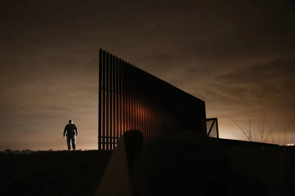 U.S. Border Patrol agent Sal De Leon stands near a section of the U.S.-Mexico border fence while stopping on patrol in La Joya, Texas, on April 10, 2013. According to the Border Patrol, undocumented immigrant crossings have increased more than 50 percent in Texas' Rio Grande Valley sector in the last year. Border Patrol agents say they have also seen an additional surge in immigrant traffic since immigration reform negotiations began this year in Washington, D.C. Proposed refoms could provide a path to citizenship for many of the estimated 11 million undocumented workers living in the United States. (John Moore/Getty Images)