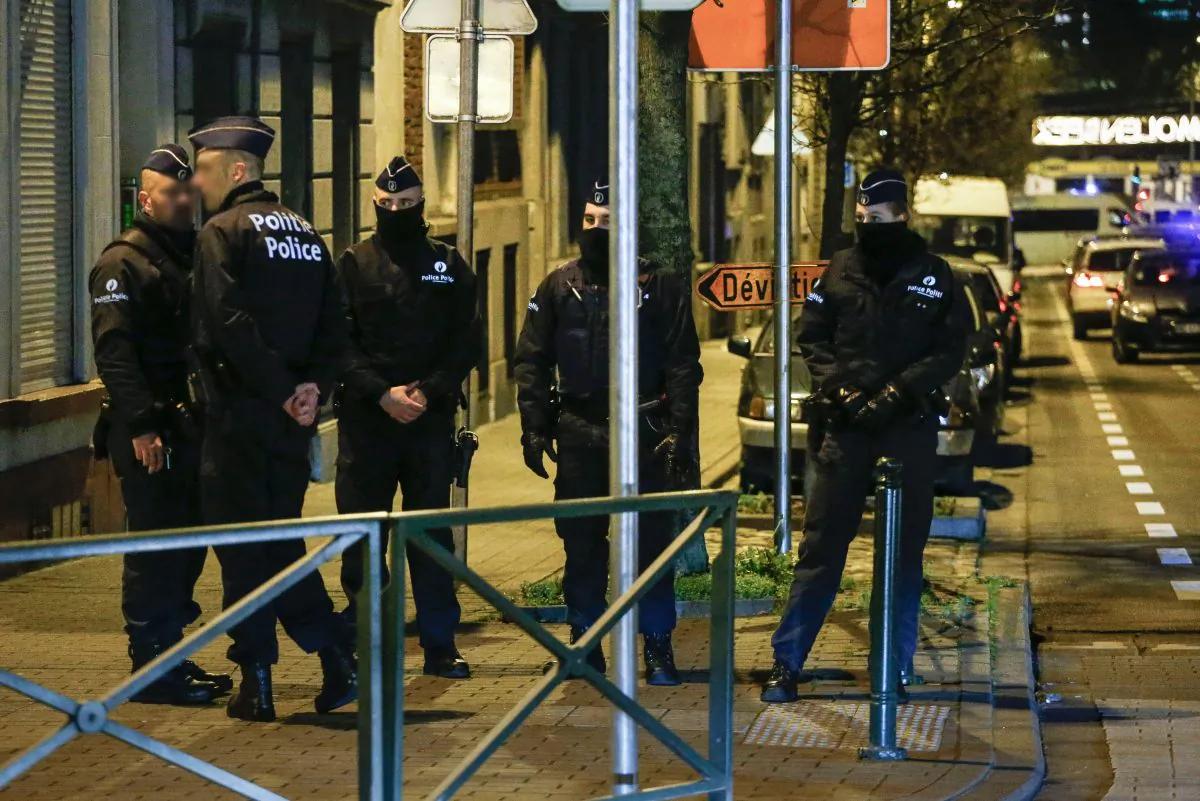 Police officers conduct new searches linked to Paris terrorist attacks, on December 30, 2015, in Molenbeek, Brussels. (THIERRY ROGE/AFP/Getty Images)