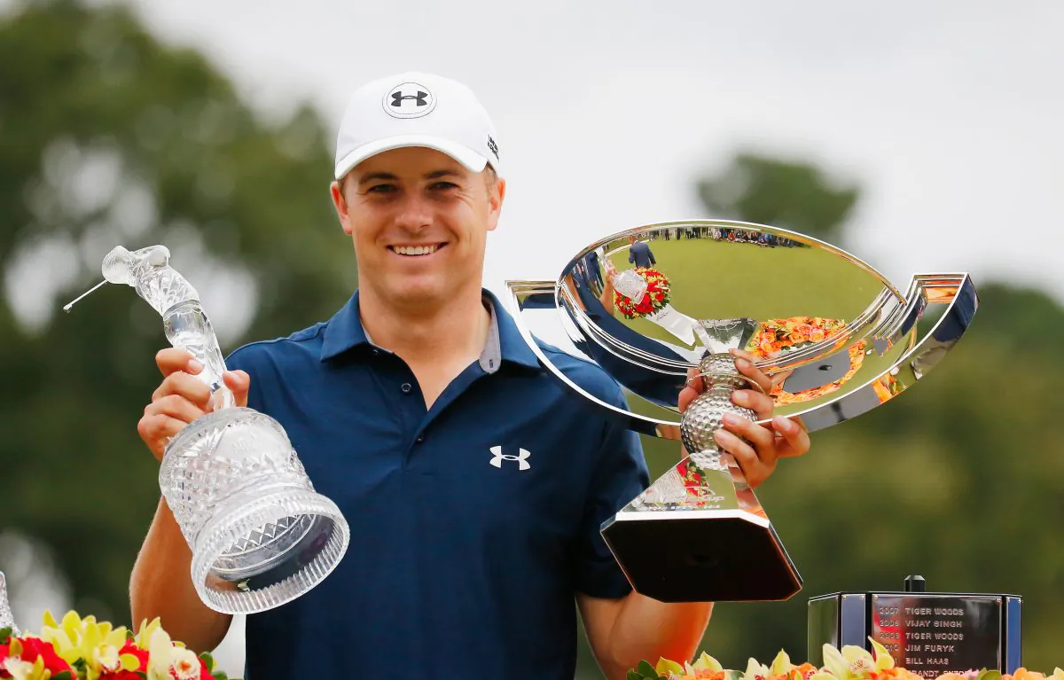 Jordan Spieth of the United States poses on the 18th green after winning both the TOUR Championship By Coca-Cola and the FedExCup at East Lake Golf Club on September 27, 2015 in Atlanta, Georgia (Kevin C. Cox/Getty Images) 
