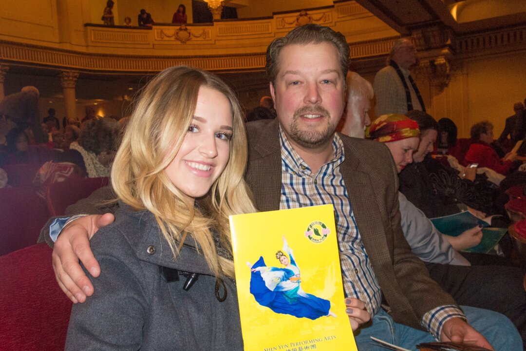 Jared Geilmann and his daughter Hannah enjoy Shen Yun Performing Arts at Salt Lake City's Janet Quinney Lawson Capitol Theatre, on Dec. 30, 2015. (Alex Ma/Epoch Times) 