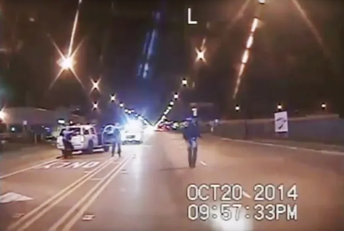 FILE - In this Oct. 20, 2014 frame from dash-cam video provided by the Chicago Police Department, Laquan McDonald, right, walks down the street moments before being shot by officer Jason Van Dyke 16 times in Chicago. Chicago officials released hundreds of emails Thursday Dec. 31, 2015 related to the video that wasn't released until more than a year after the shooting. The emails, including some between city officials asking how they should respond to demands for the video, were released to media outlets that have been pressing for the documents for weeks. (Chicago Police Department via AP, File)