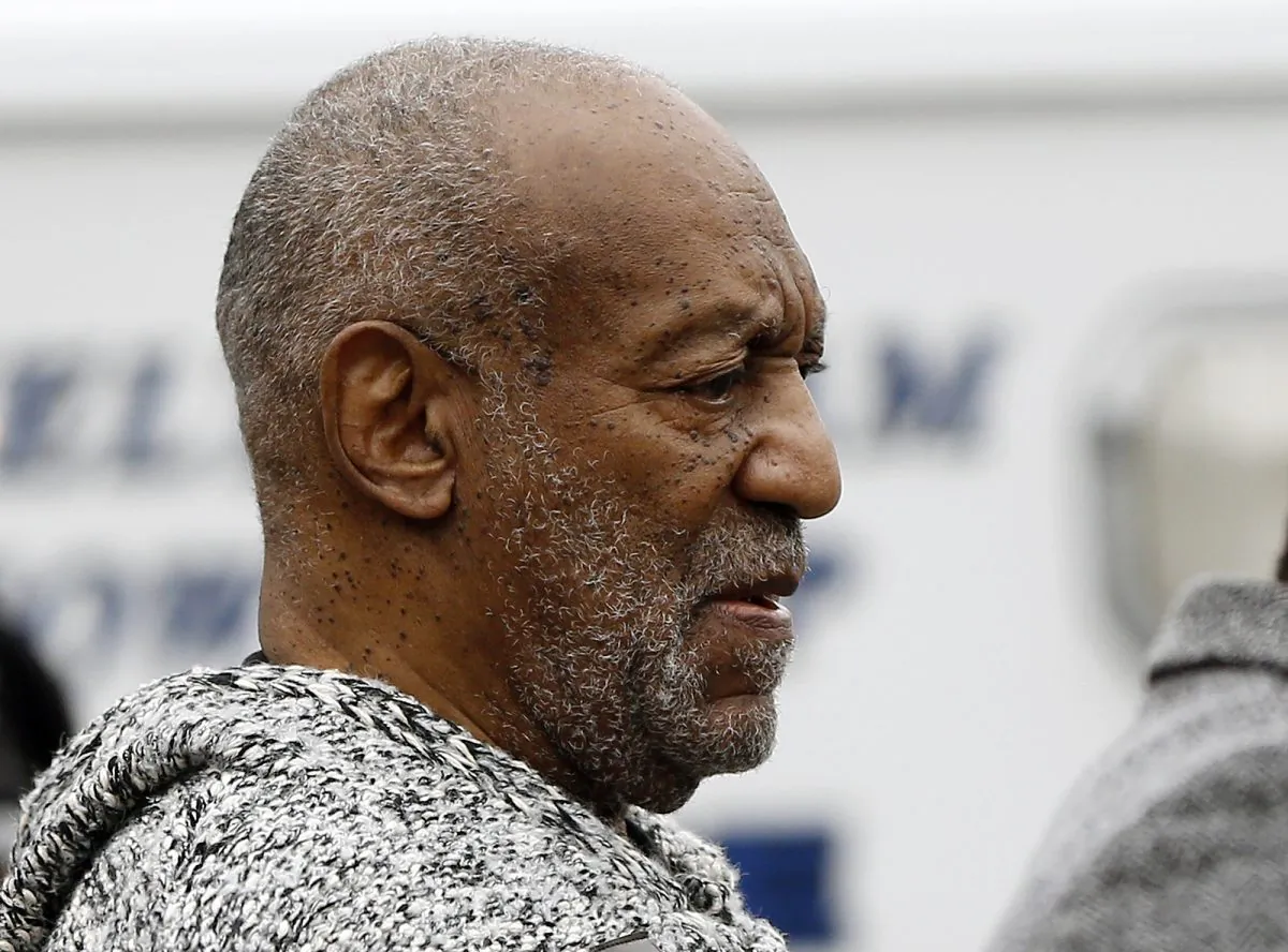 Bill Cosby leaves the Cheltenham Township Police Department where he was processed after being arraigned on a felony charge of aggravated indecent assault Wednesday, Dec. 30, 2015, in Elkins Park, Pa. (AP Photo/Matt Rourke)