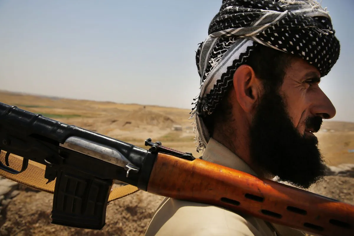 Kurdish Peshmerga soldier pauses at an outpost on the edges of the contested city of Kirkuk in Iraq on July 3, 2014. (Spencer Platt/Getty Images)