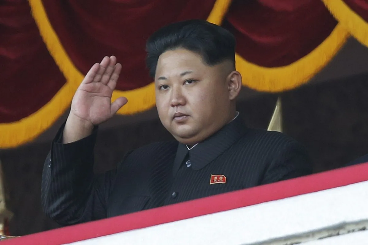 North Korean leader Kim Jong-un gestures as he watches a military parade in Pyongyang, North Korea, on Oct. 10, 2015. (AP Photo/Wong Maye-e)