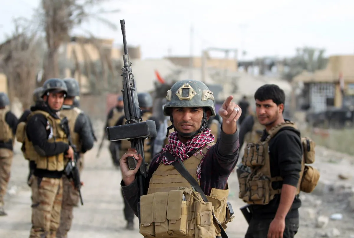Members of Iraq's elite counterterrorism service secure the Hoz neighborhood in central Ramadi, the capital of Iraq's Anbar Province, during military operations conducted by Iraqi pro-government forces against the Islamic State on Dec. 27, 2015. (Ahmad al-Rubaye/AFP/Getty Images)