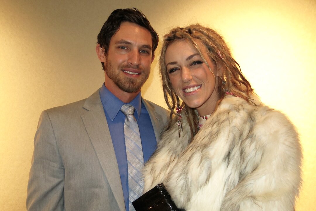  Chris and Leyna Luttrull enjoy Shen Yun Performing Arts at Grand Rapids’s DeVos Performance Hall, on Dec.30, 2015. (Charlie Lu/Epoch Times)