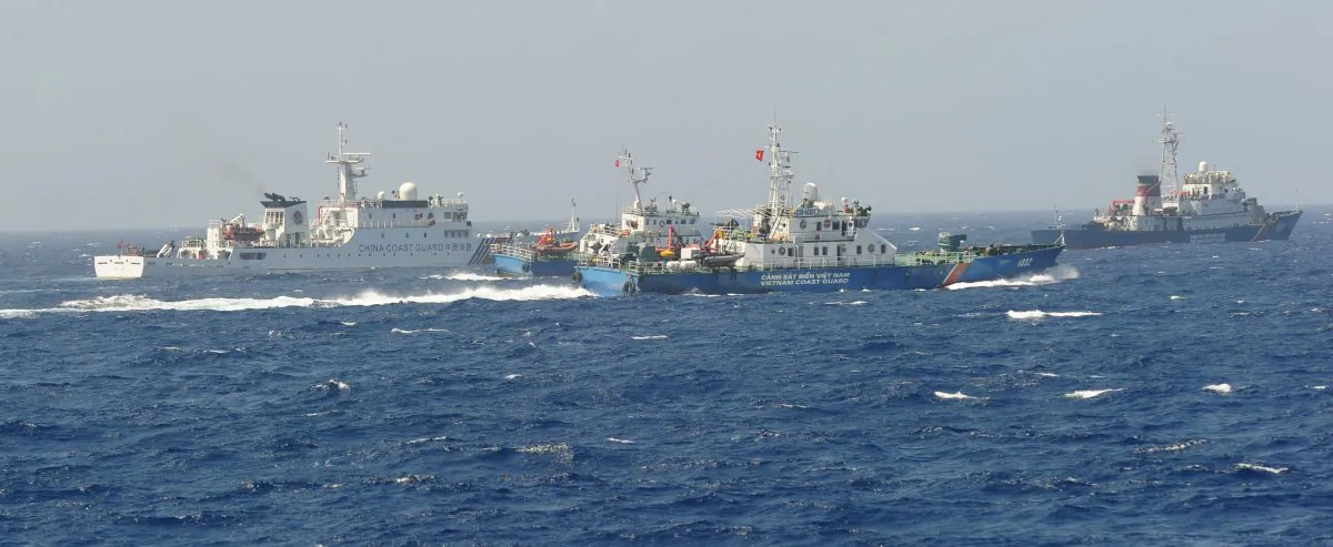A Chinese coast guard ship (L) being blocked by three Vietnamese coast guard vessels near China's oil drilling rig in disputed waters in the South China Sea on May 15, 2014. (Hoang Dinh Nam/AFP/Getty Images)