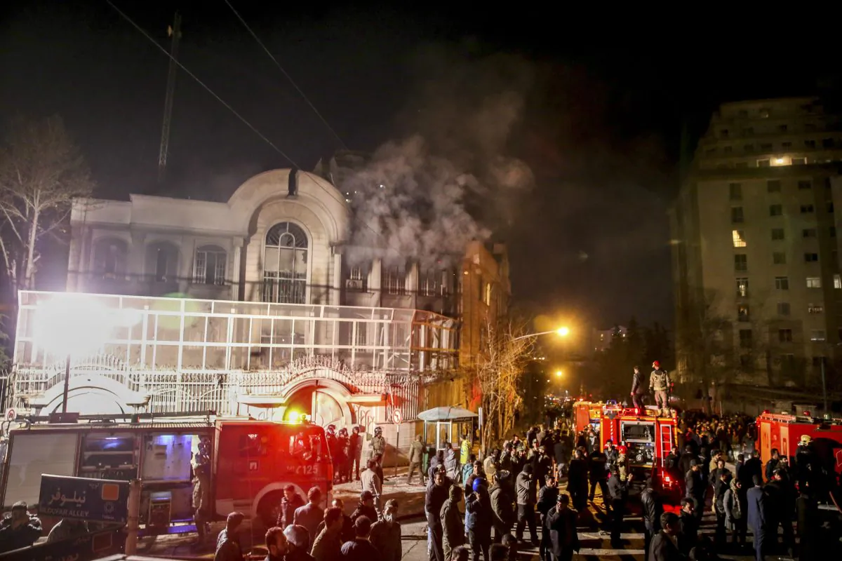 Smoke rises as Iranian protesters set fire to the Saudi Embassy in Tehran on Jan. 3, 2016. (Mohammadreza Nadimi/ISNA via AP)