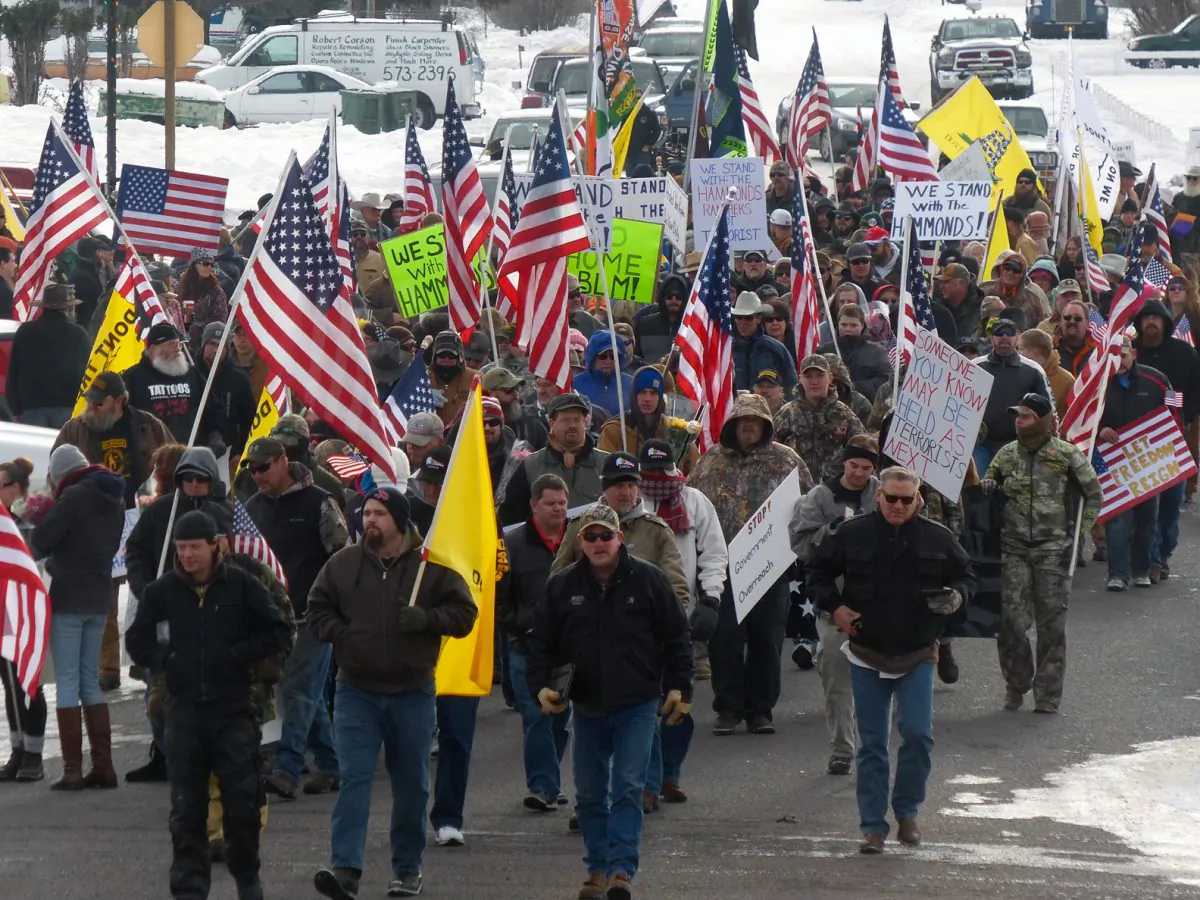 Protesters march on Court Avenue in support of an Oregon ranching family facing jail time for arson in Burns, Ore., on Jan. 2, 2016. (Les Zaitz/The Oregonian via AP)