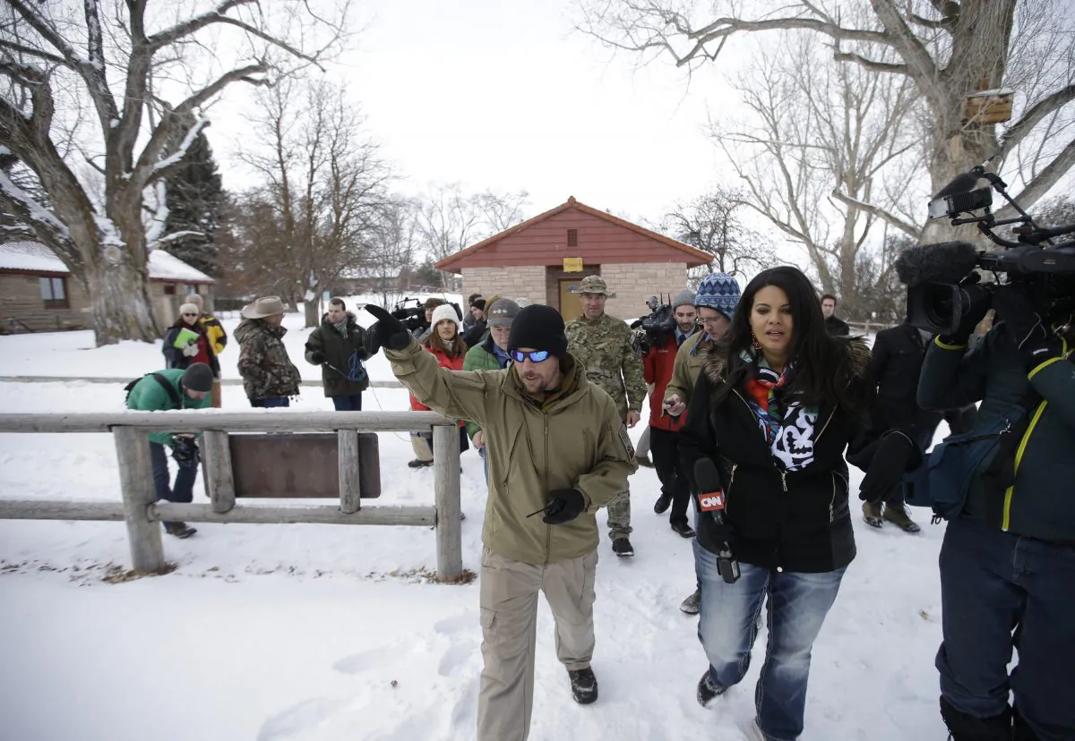 A member of the group occupying the Malheur National Wildlife Refuge headquarters conducts a tour with the media Monday, Jan. 4, 2016, near Burns, Ore. (AP Photo/Rick Bowmer)