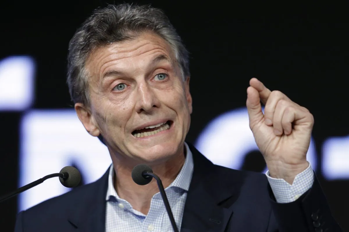 Argentina's President Mauricio Macri speaks during a meeting with the Argentine Industrial Union in Buenos Aires, Argentina, on Dec. 14, 2015. Macri is vowing to crack down on drug trafficking amid a national manhunt for three escaped prisoners convicted in drug-related killings. On Monday, Jan. 4, 2016, Macri accused the previous administration of President Cristina Fernandez of allowing drug trafficking to increase. (AP Photo/Victor R. Caivano)