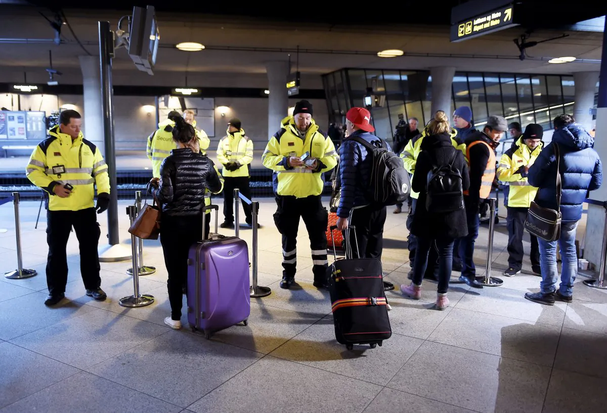 Security staff check IDs at Kastrups train station outside Copenhagen, Denmark, Monday, Jan.  2015. (Bjorn Lindgren / TT News Agency via AP) 