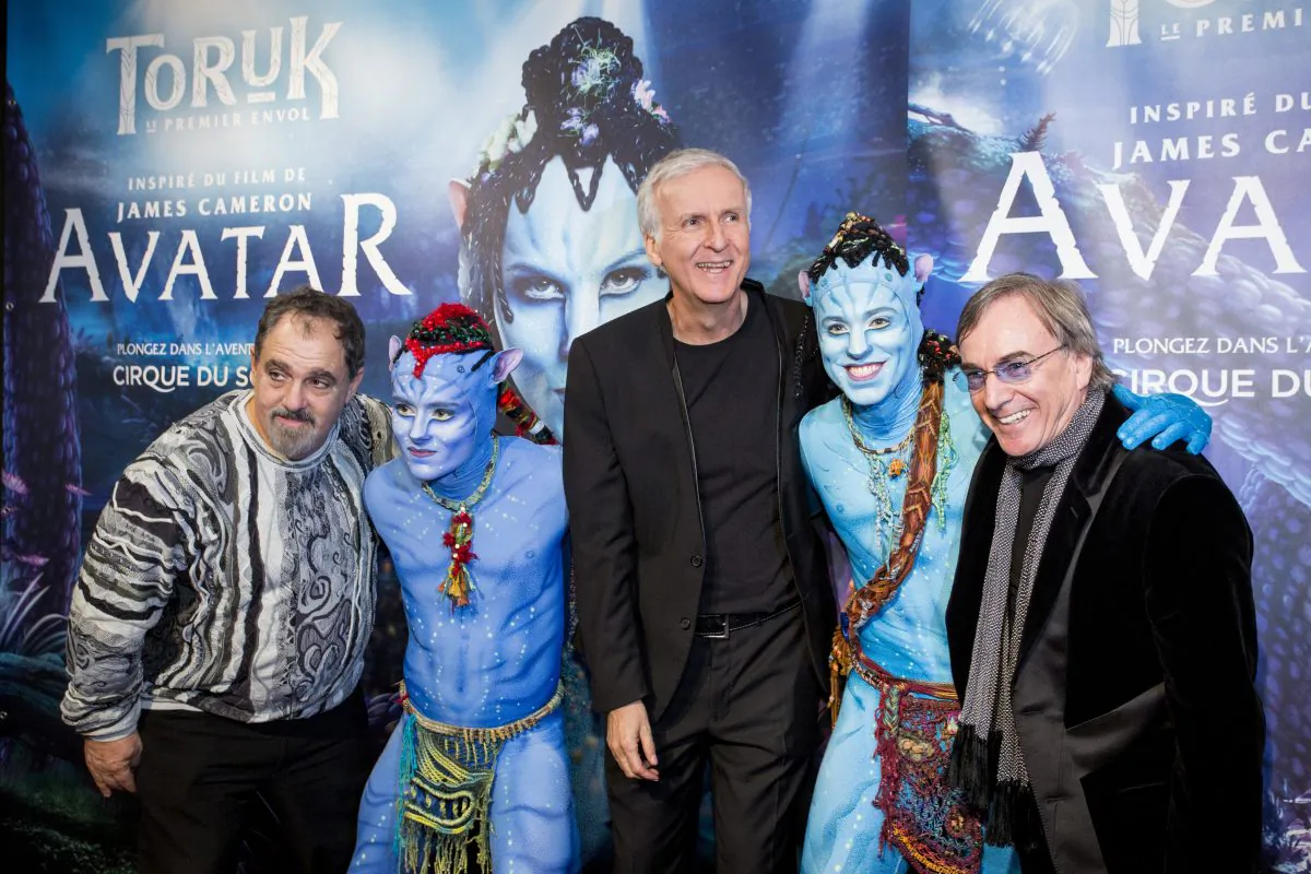 “Avatar” producer Jon Landau, director James Cameron, Cirque du Soleil president Daniel Lamarre with Entu and Ralu, characters from “Toruk – The First Flight” at the world premiere in Montreal, December 21, 2015.  (Courtesy Cirque du Soleil)