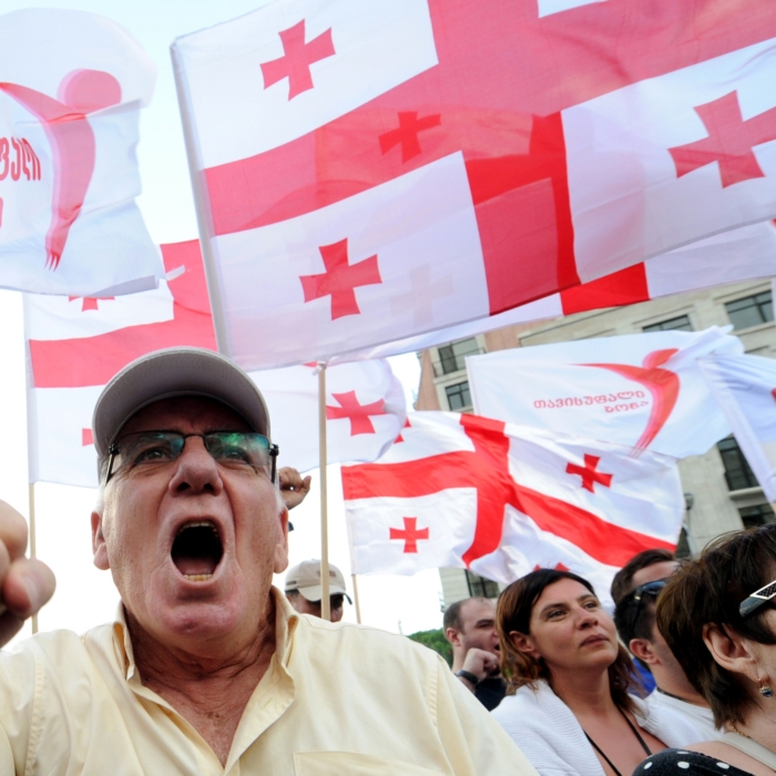 Protesters wave Georgia's national flag, also known as the Five Cross Flag, as they take part in a rally against Russia in Tbilisi on July 18, 2015. Over 3,000 people took to the streets in Georgia on Saturday to protest what they called Moscow's occupation of the breakaway South Ossetia and Abkhazia regions. (Vano Shlamov/AFP/Getty Images)