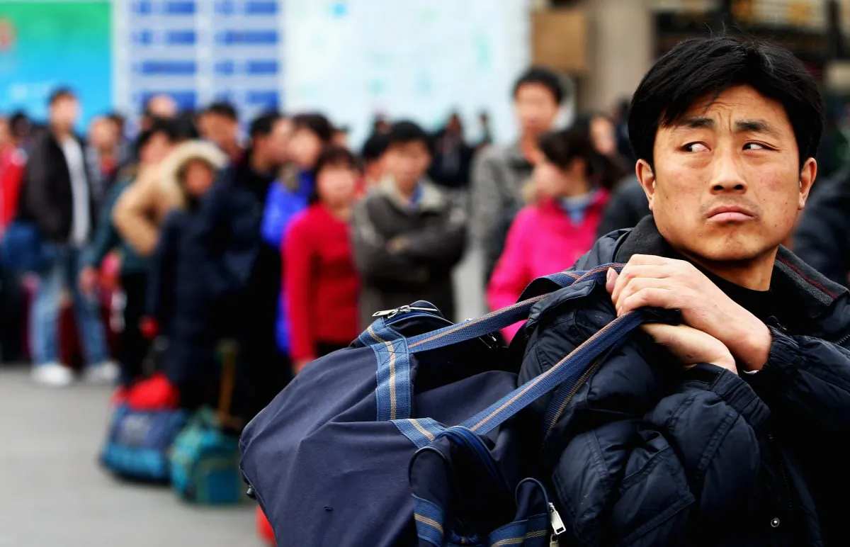 A migrant workers at the West Railway Station in Beijing on Feb. 2, 2009. (Guang Niu/Getty Images)