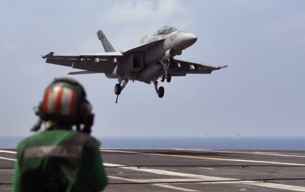 A U.S. Navy fighter jet approaching to land on the U.S. Navy aircraft carrier USS Theodore Roosevelt during Exercise Malabar 2015 about 150 miles off Chennai, India, on Oct. 17, 2015. The U.S. Pacific Fleet is smaller than it was in the 1990s, helping fuel a debate about whether the U.S. has enough ships to meet challenges posed by fast-growing and increasingly assertive Chinese naval forces. (AP Photo/Arun Sankar K.)