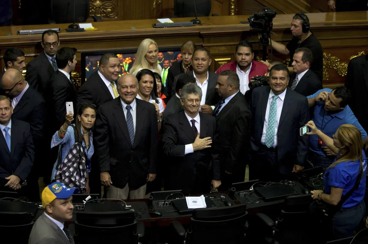 Henry Ramos Allup, incoming congress president, greets members of the news media upon his arrival to the National Assembly in Caracas, Venezuela, on  Jan. 5. (AP Photo/Fernando Llano)