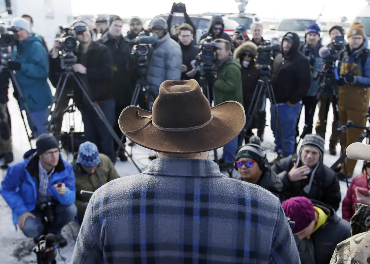Ammon Bundy, one of the sons of Nevada rancher Cliven Bundy, speaks to reporters during a news conference at Malheur National Wildlife Refuge Wednesday, Jan. 6, 2016, near Burns, Ore. (AP Photo/Rick Bowmer)