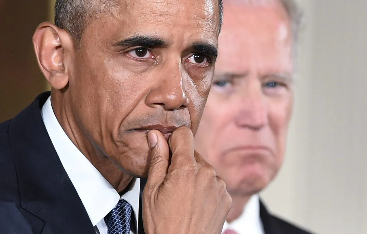 President Barack Obama gets emotional as he speaks on reducing gun violence in the East Room of the White House in Washington, D.C., on Jan. 5, 2016. At right is Vice President Joe Biden. (Mandel Ngan/AFP/Getty Images)