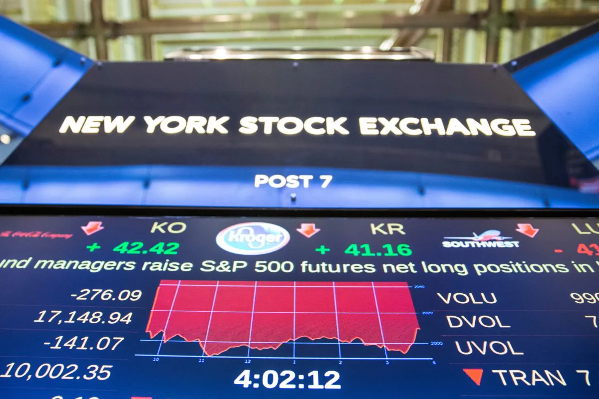 A screen shows the New York Stock Exchange during the afternoon of Jan. 4 the first day of trading for 2016. Despite a rocky start to the year, analysts expect a better year than 2015. (Andrew Burton/Getty Images)