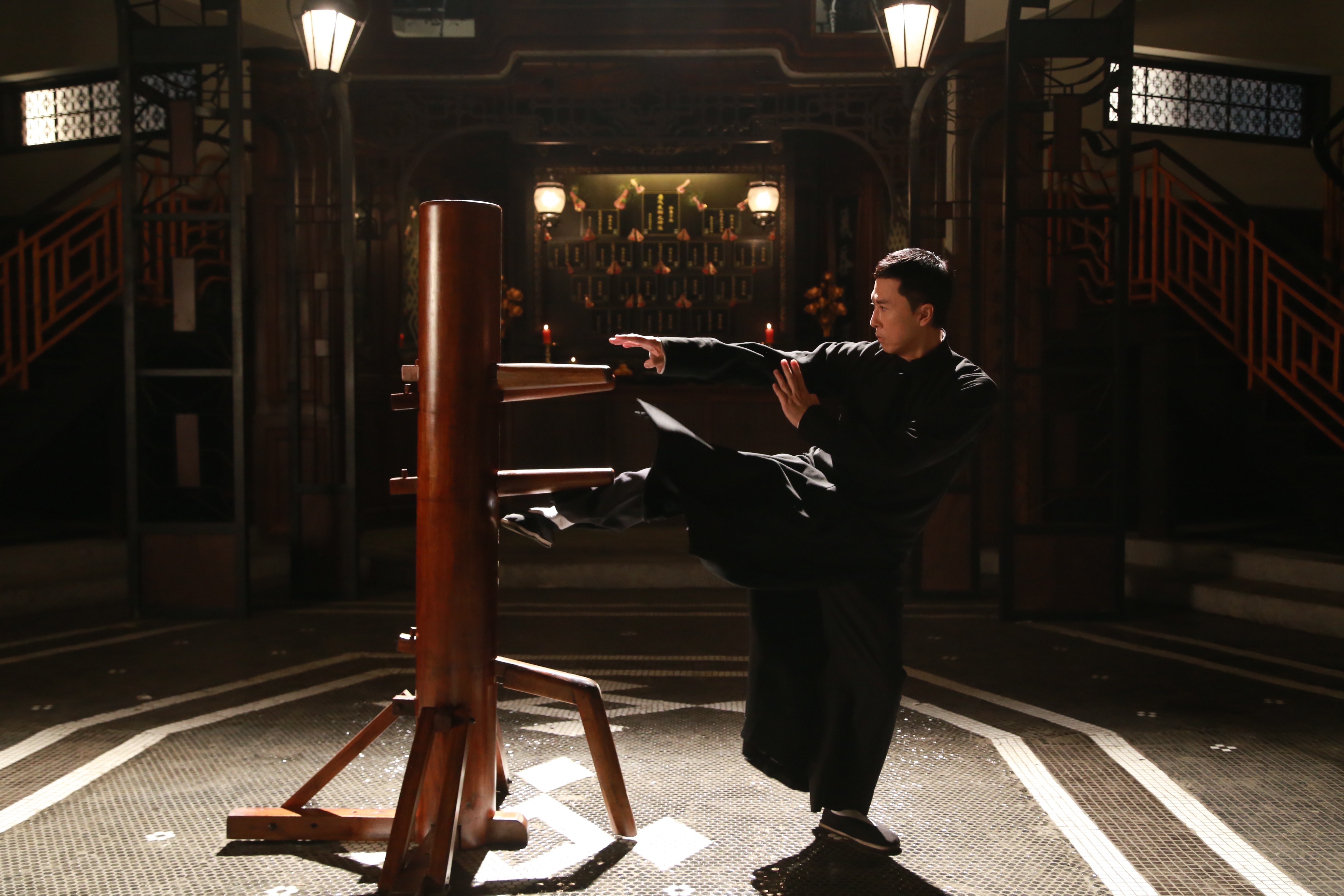 Donnie Yen as Ip Man, practicing on the Wing Chun Kung fu "wooden man&...