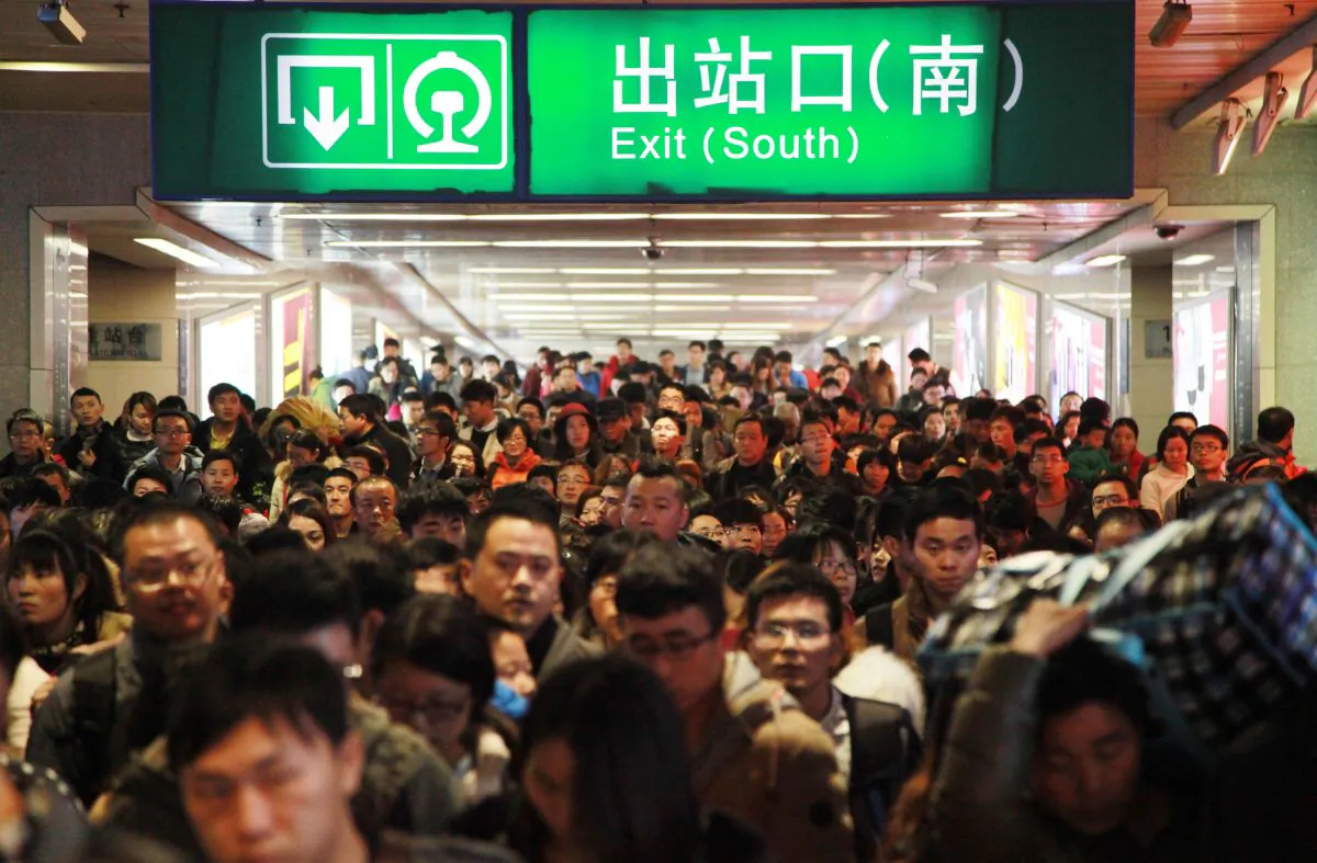 Passengers walk out of Nanjing Railway Station on February 24, 2015 in Nanjing, China. In China's financial markets, traders are also heading for the exits. (ChinaFotoPress/Getty Images)
