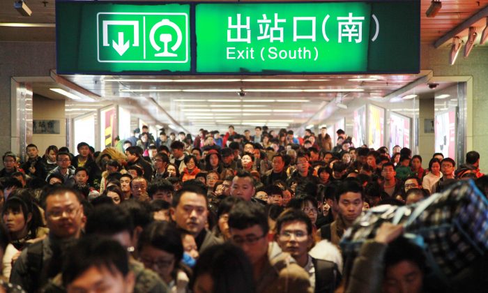 Passengers walk out of Nanjing Railway Station on February 24, 2015 in Nanjing, China. In China's financial markets, traders are also heading for the exits. (ChinaFotoPress/Getty Images)