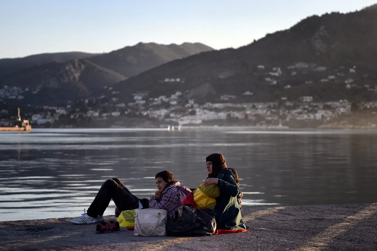 Migrants from Syria wait in the port of Mytilene on the Greek island of Lesbos on Dec. 6, 2015. (Aris Messinis/AFP/Getty Images)