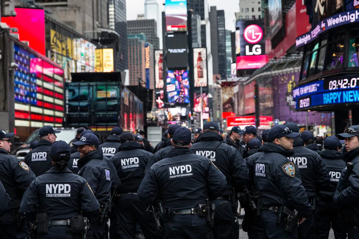 Counterterrorism police officers are briefed in Times Square prior to the Times Square New Year's Eve celebration in New York City on Dec. 31, 2015. The NYPD will have more than 6,000 officers in the Times Square area, including more than 1,100 officers who graduated from the police academy on Tuesday. It will be the largest such deployment of police in New York City ever. (Andrew Burton/Getty Images)