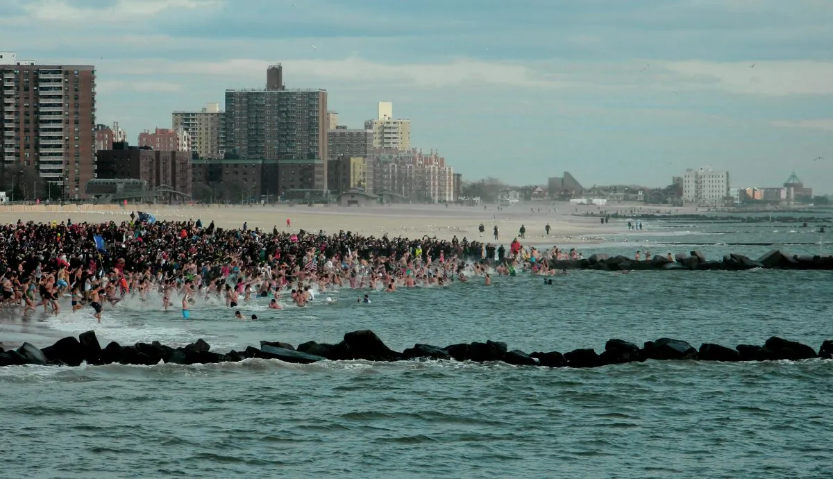 People run into the water in the Polar Bear Plunge in Coney Island, New York City, in Dec. 1, 2016. (Courtesy of Joe Abate)