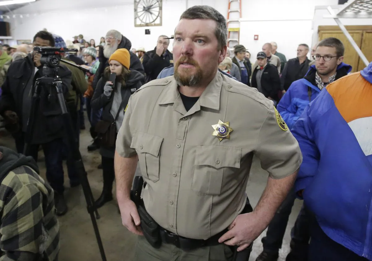 Harney County Sheriff David Ward arrives to a community meeting at the Harney County fairgrounds in Burns, Ore., on Jan. 6, 2016. (AP Photo/Rick Bowmer)