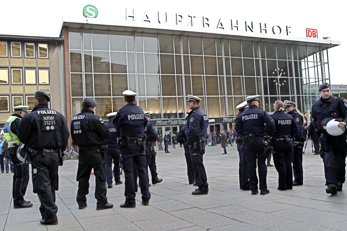 Police officers patrol  in  front of the  main station of Cologne, Germany, on Wednesday, Jan. 6, 2016.  (AP Photo/Hermann J. Knippertz)