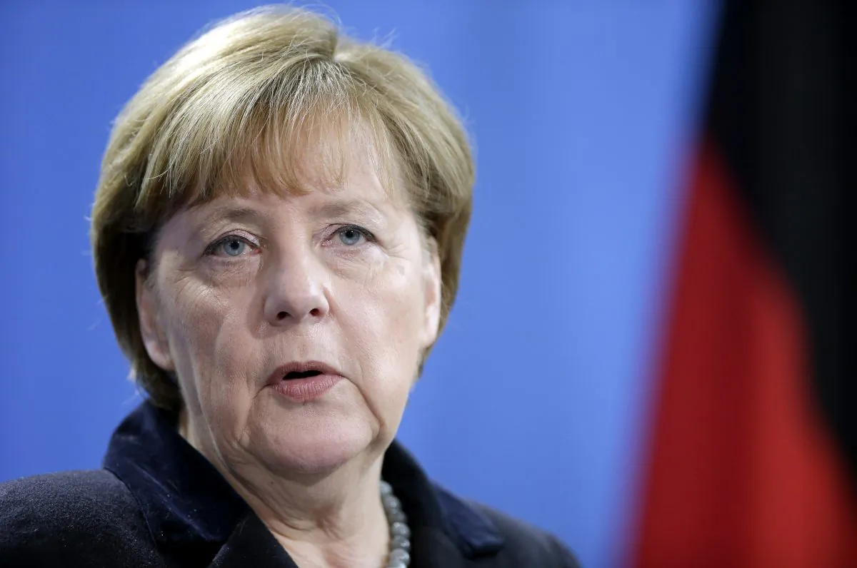 German Chancellor Angela Merkel speaks during a joint news conference with the Prime Minister of Romania, Dacian Ciolos, as part of a meeting at the chancellery in Berlin, Germany, on Jan. 7, 2016. (AP Photo/Michael Sohn)