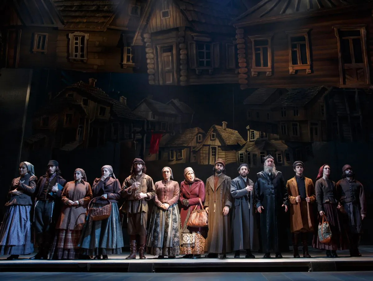 The cast of “Fiddler on the Roof” as the folk of Anatevka, soon to be refugees from their beloved home and way of life. (Joan Marcus)