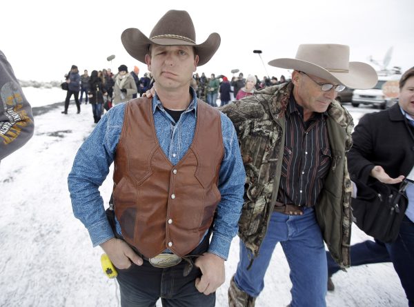 Ryan Bundy, one of the sons of Nevada rancher Cliven Bundy, walks to a news conference at Malheur National Wildlife Refuge near Burns, Ore., on Jan. 7, 2016. A small, armed group occupying the wildlife preserve has said repeatedly that local people should control federal lands, but critics say the lands are already managed to help everyone from ranchers to recreationalists. (AP Photo/Rick Bowmer)