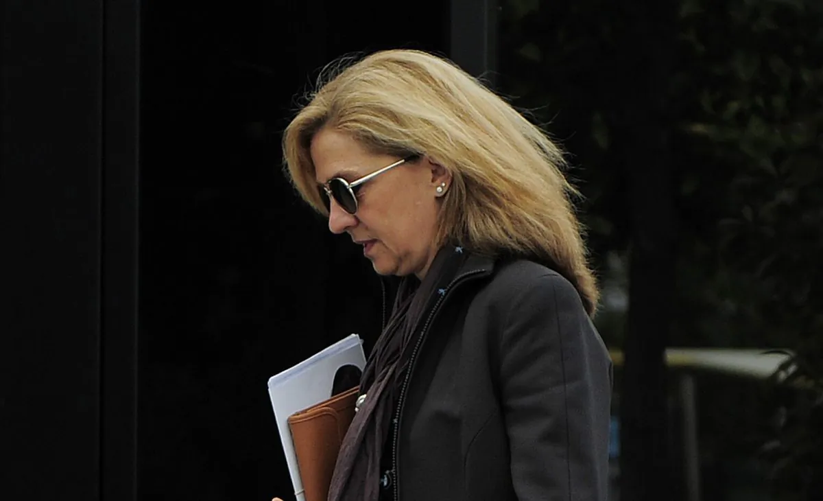 Spain's Princess Cristina walks toward her office in Barcelona, Spain, on April 5, 2013. The 50-year-old princess and her husband are set to face anti-monarchy protesters and hordes of media on Jan. 11, 2016, as they enter a makeshift courtroom and she makes history in front of millions of Spanish TV viewers as the first royal family member to face criminal charges since the monarchy was restored in 1975. (AP Photo/Manu Fernande)