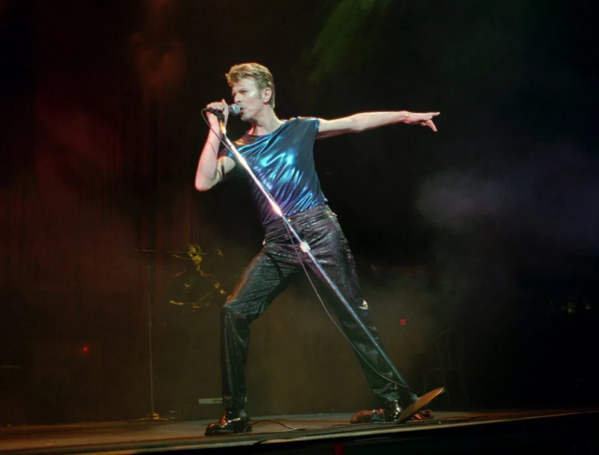 On Sept. 14, 1995, David Bowie performs in Hartford, Conn. (AP Photo/Bob Child, File)