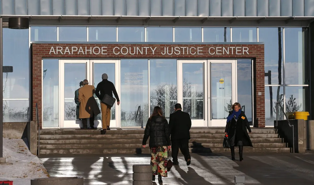 People enter the Arapahoe County Justice Center in Centennial, Colo., on Jan. 20, 2015. Months after the Colorado theater shooting trial, jurors who served said they're still troubled by flashbacks and nightmares, survivor's guilt and hypervigilance that have made it impossible to return to their normal lives. (AP Photo/Brennan Linsley)