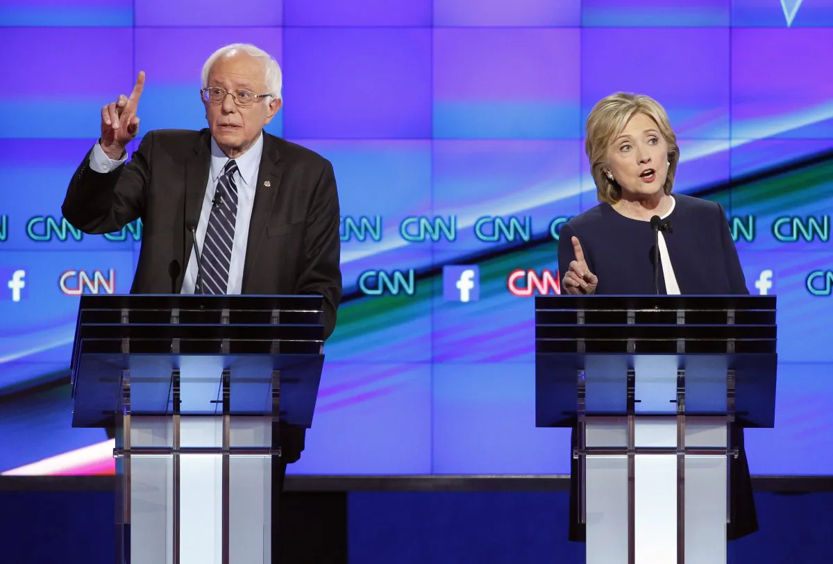 Democratic presidential candidates Hillary Clinton (R) and Sen. Bernie Sanders (I-Vt.) at a Democratic presidential debate in Las Vegas. (AP Photo/John Loche)
