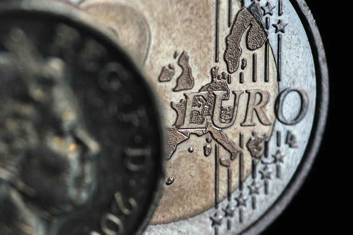A two euro coin and a GBP1 coin are displayed in London, England, on Nov. 26, 2010. (Dan Kitwood/Getty Images)