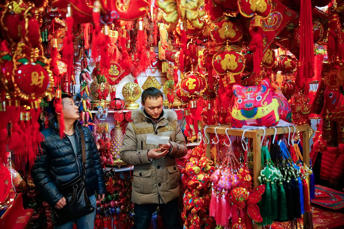 Chinese people buy decorations for the upcoming Chinese Lunar New Year of the sheep in Beijing on Feb. 12. (Lintao Zhang/Getty Images)