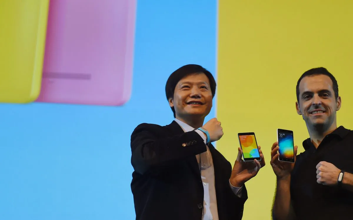 Xiaomi Global CEO Lei Jin (L) poses for a photo with Xiaomi Global Vice President Hugo Barra during an event in New Delhi on April 23, 2015. Xiaomi's user agreement requires customers to follow the Chinese regime's standards on censorship. (Money Sharma/AFP/Getty Images)