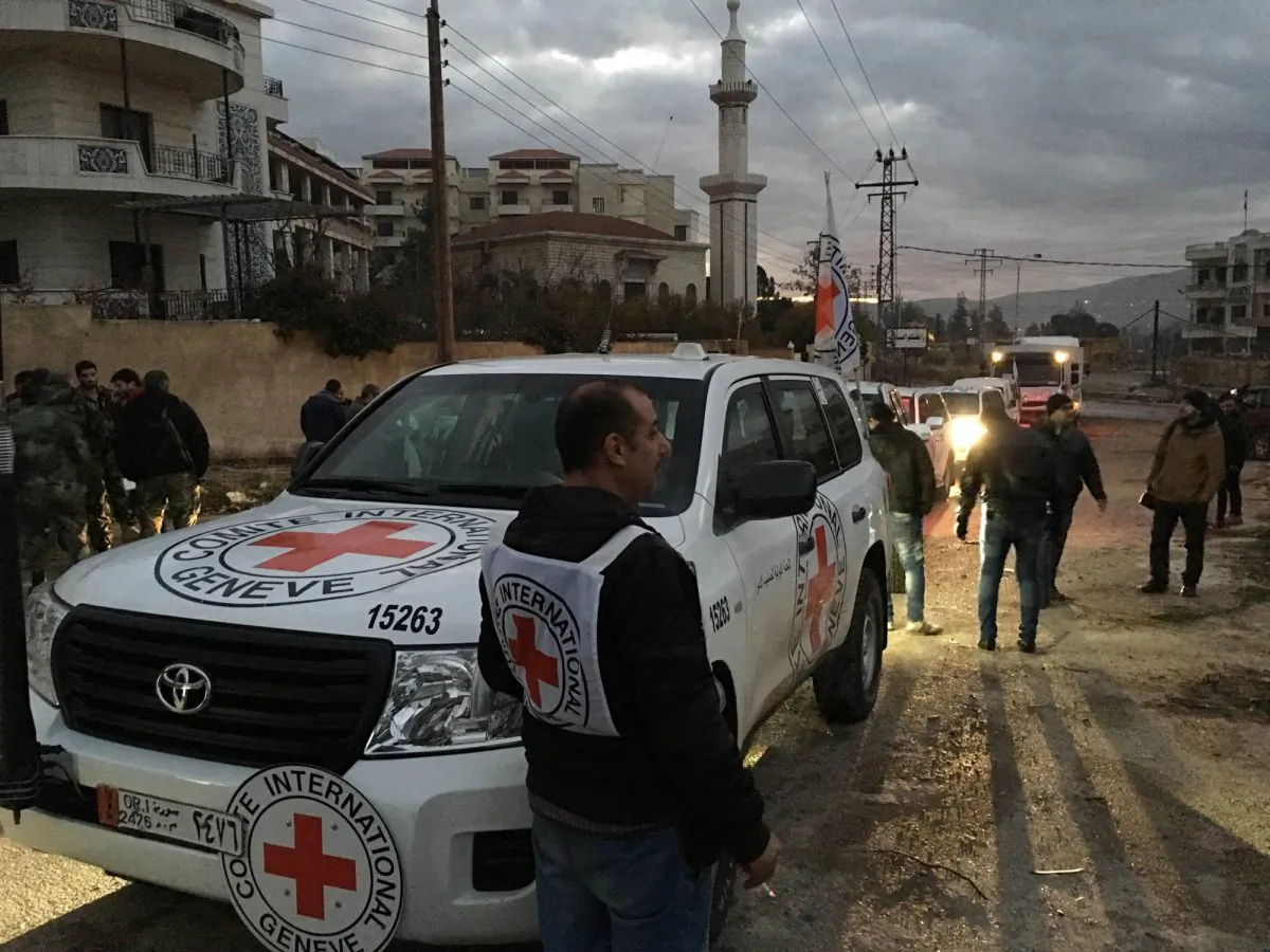This picture provided by The International Committee of the Red Cross (ICRC), working alongside the Syrian Arab Red Crescent (SARC) and the United Nations (UN), shows a convoy containing food, medical items, blankets and other materials being delivered to the town of Madaya in Syria on Jan. 11, 2016. The town, about 15 miles (24 kilometers) northwest of Damascus, has been blockaded for months by government troops and the Lebanese militant group Hezbollah. Opposition activists and aid groups have reported several deaths from starvation in recent weeks. (ICRC via AP)