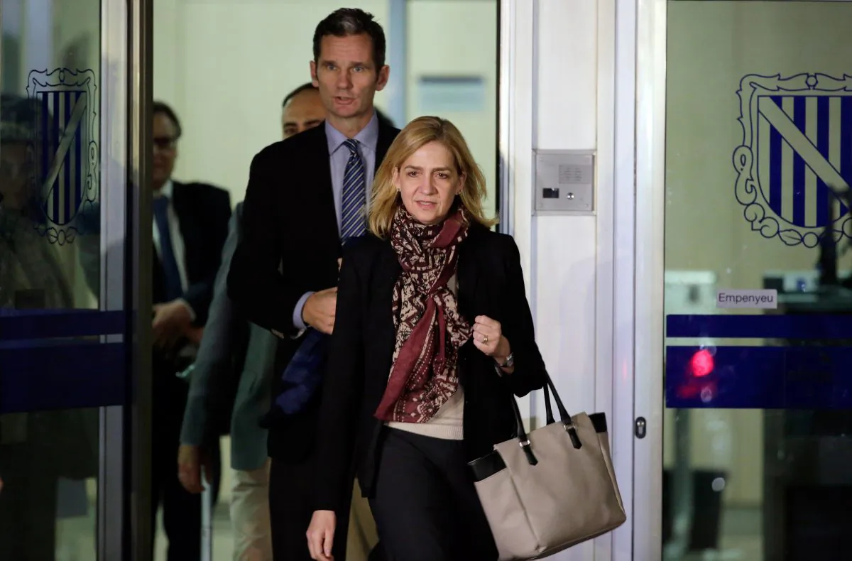 Spain's Princess Cristina and her husband Inaki Urdangarin leave a makeshift courtroom on the first day of a corruption trial, in Palma de Mallorca, Spain, on Jan. 11, 2016. Spain’s Princess Cristina spent 12 hours in court Monday at the start of her landmark criminal case, confronting accusations of bankrolling a lavish lifestyle with funds her husband received from an alleged scheme to embezzle millions from public contracts for conferences and sporting events. (AP Photo/Emilio Morenatti)