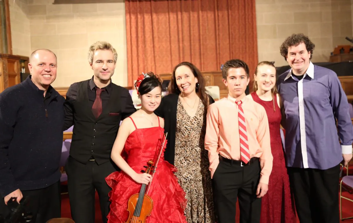 From the Jan.10th Shining Stars Concert: (L–R) Conductor Paul Hostetter, clarinetist Adrian Cunningham, violinist Yurie Minamaya, artistic director/founder Julie Jordan, violinist Christian Maloney, Sophia Steger, and Irish stepdancer and folk spoon player Niall O’Leary.  (Mark Minaly)