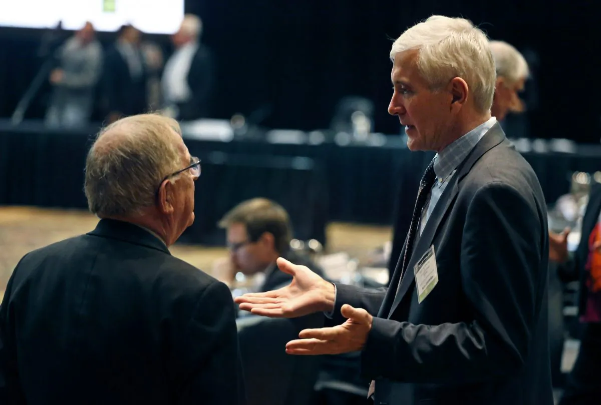 Norwegian anti-doping expert Rune Andersen (R) speaks with Warwick Gendall of New Zealand before a meeting of the World Anti-Doping Agency (WADA) at the Broadmoor Hotel in Colorado Springs on Nov. 18, 2015. Rune Andersen the head of the IAAF taskforce set up to determine whether Russia's ban from global track and field should be lifted says the country is making efforts to reform after its doping scandal. (AP Photo/Brennan Linsley)