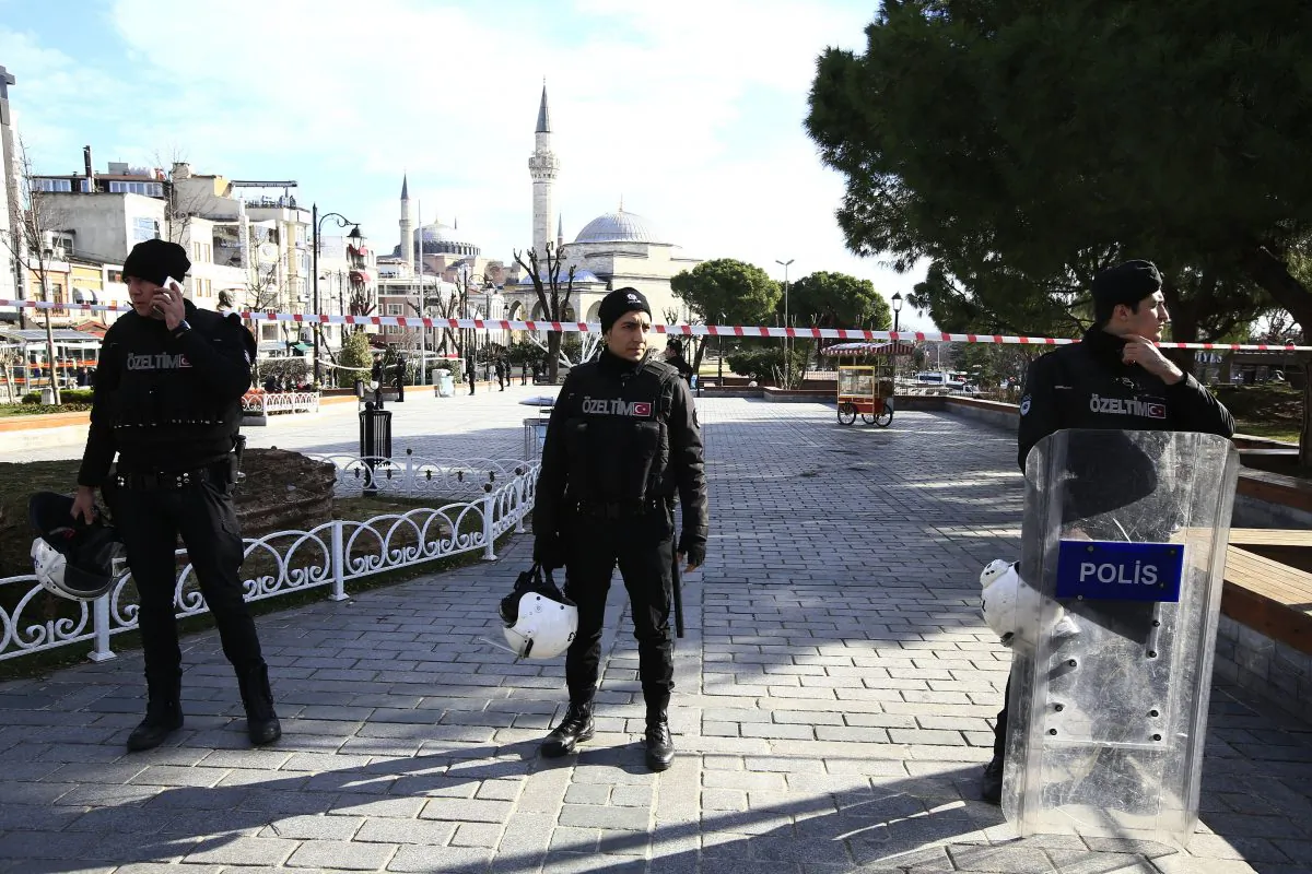 Policemen secure an area at the historic Sultanahmet District, which is popular with tourists, after an explosion in Istanbul on Jan. 12, 2016. (AP Photo/Lefteris Pitarakis)